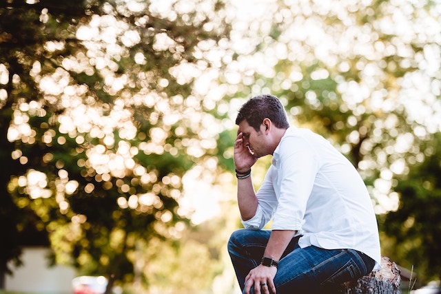 man-depressed-thinking-confused-outdoors