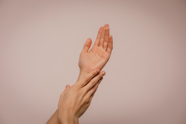 person-touching-hand-skin